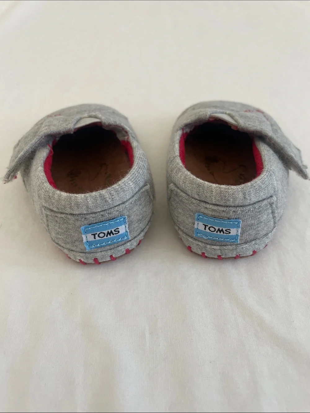 Toms Grey Slip-On Baby Shoes with Red Accents and Rooster Stitch (NWOT) size 2